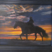 Cowboy Riding in Sunset